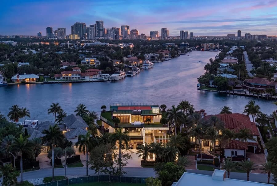 Aerial view of Fort Lauderdale canals, waterfront homes and skyline at dusk